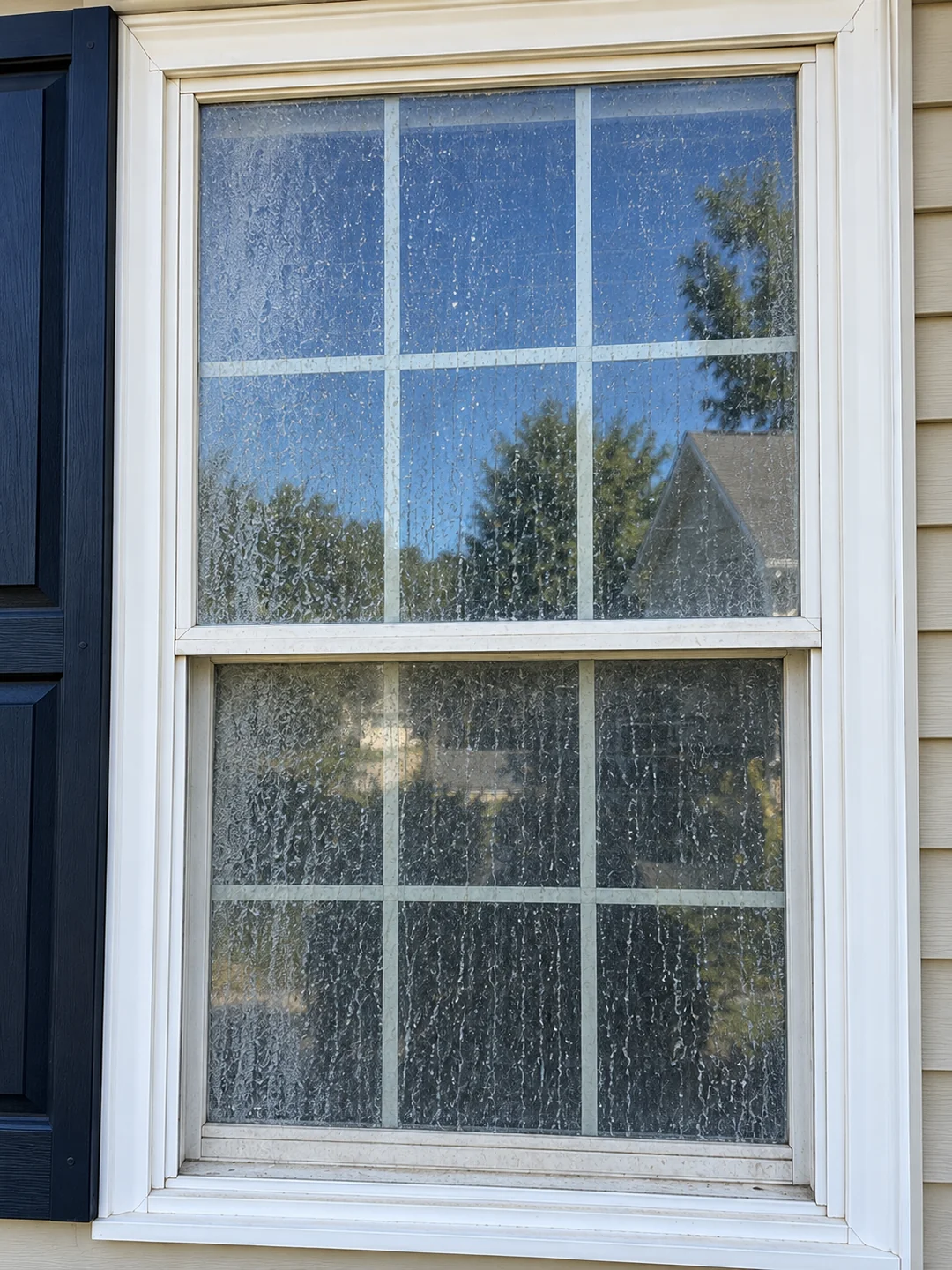 Spotty, dirty window before cleaning