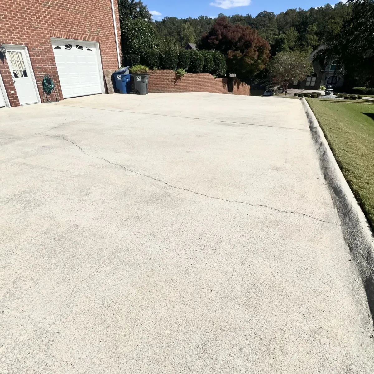 Freshly pressure-washed concrete driveway