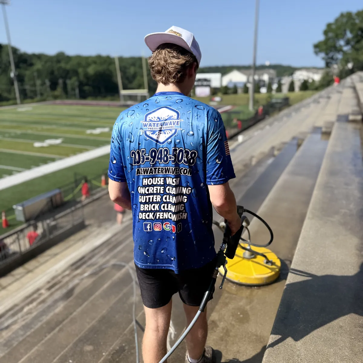 Pressure washing near an athletic field