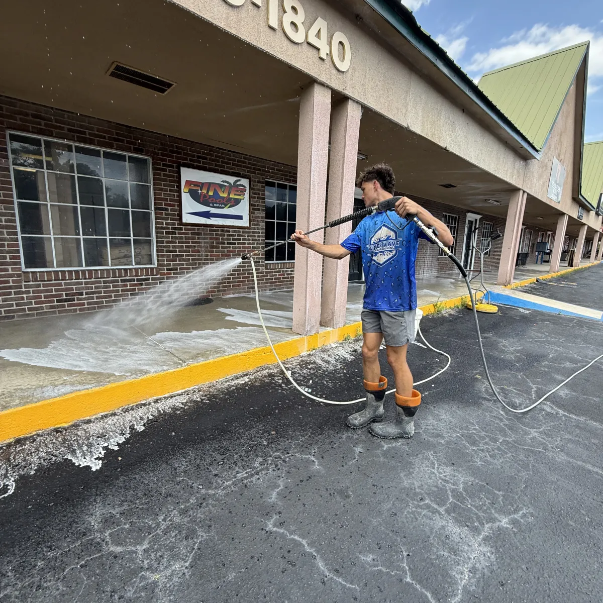 Pressure washing a commercial parking lot