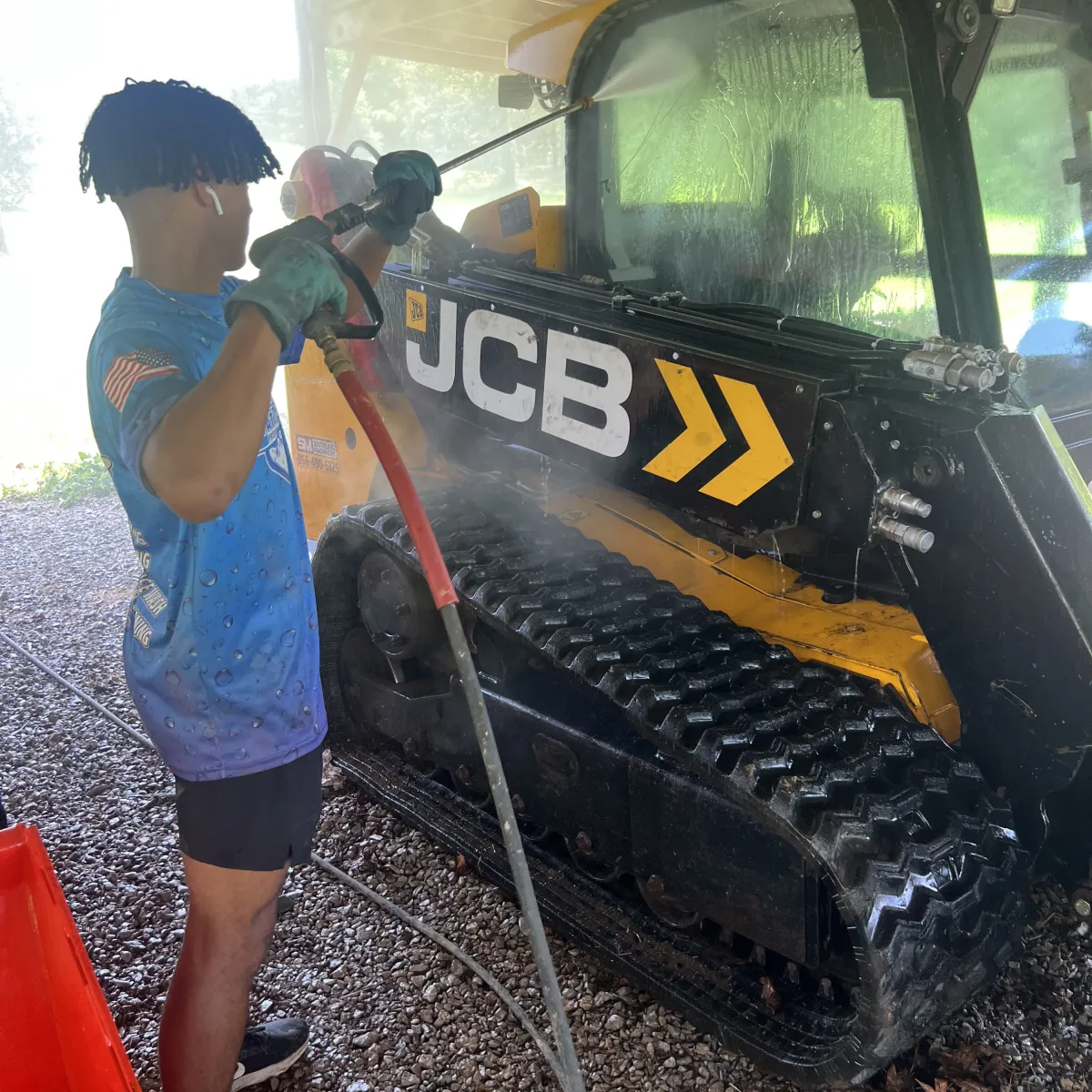 Pressure washing heavy equipment